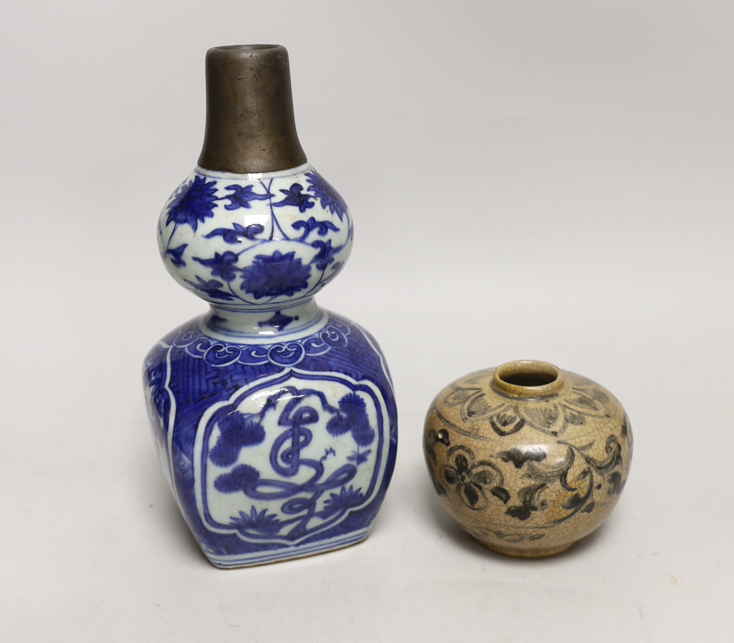 A Chinese blue and white double gourd vase and a smaller crackle glaze jar, tallest 23cm